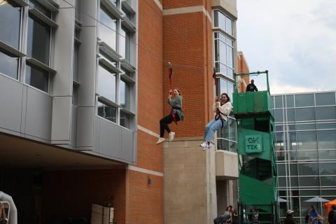Students on the building zip line