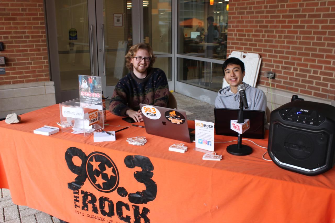 Campus radio station table at the petting zoo